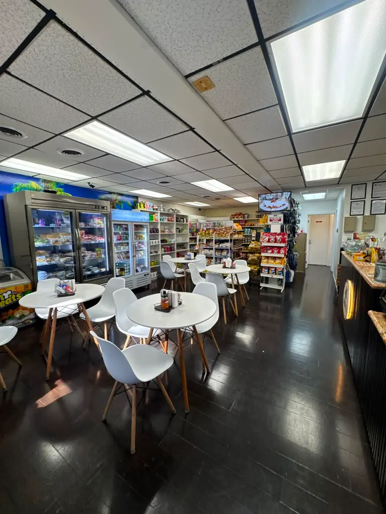 Interior of Paradise Brazilian Imports with Brazilian market shelves and café seating